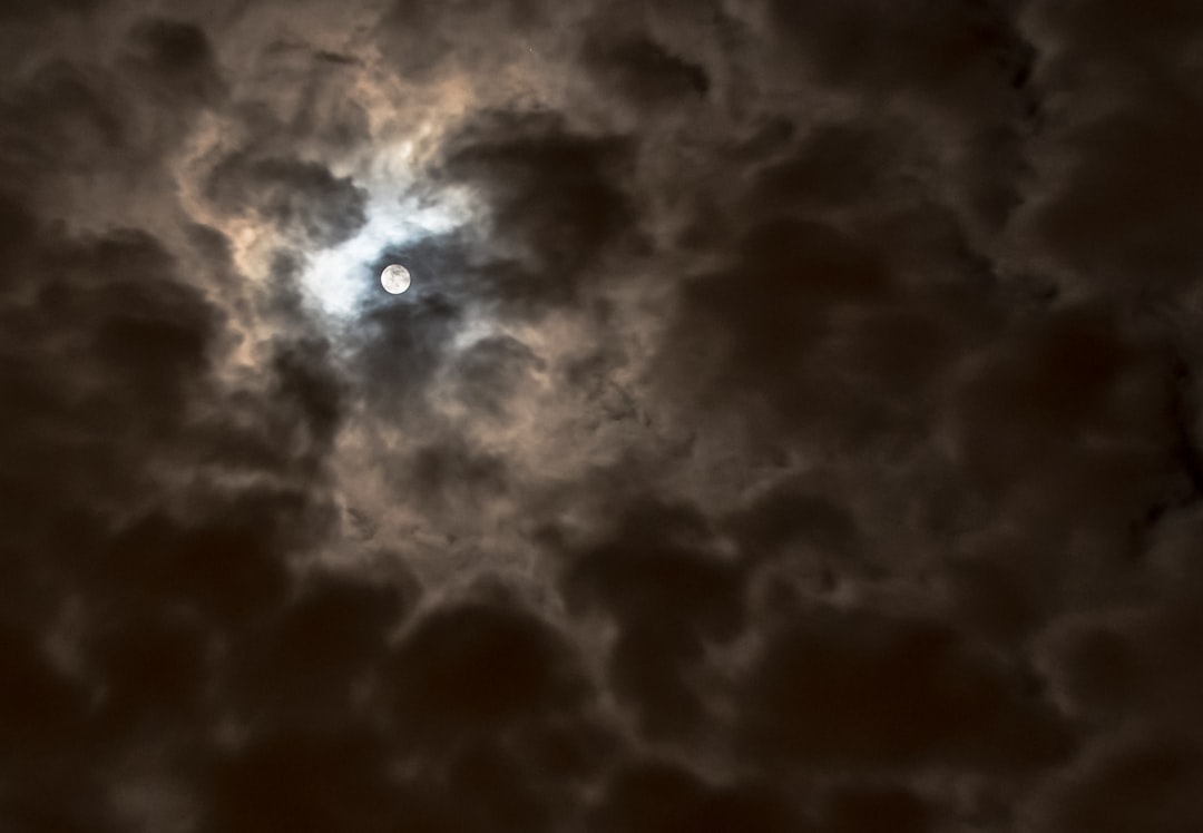 Full moon over Greece by Dreams About full moon on cloudy sky during nighttime